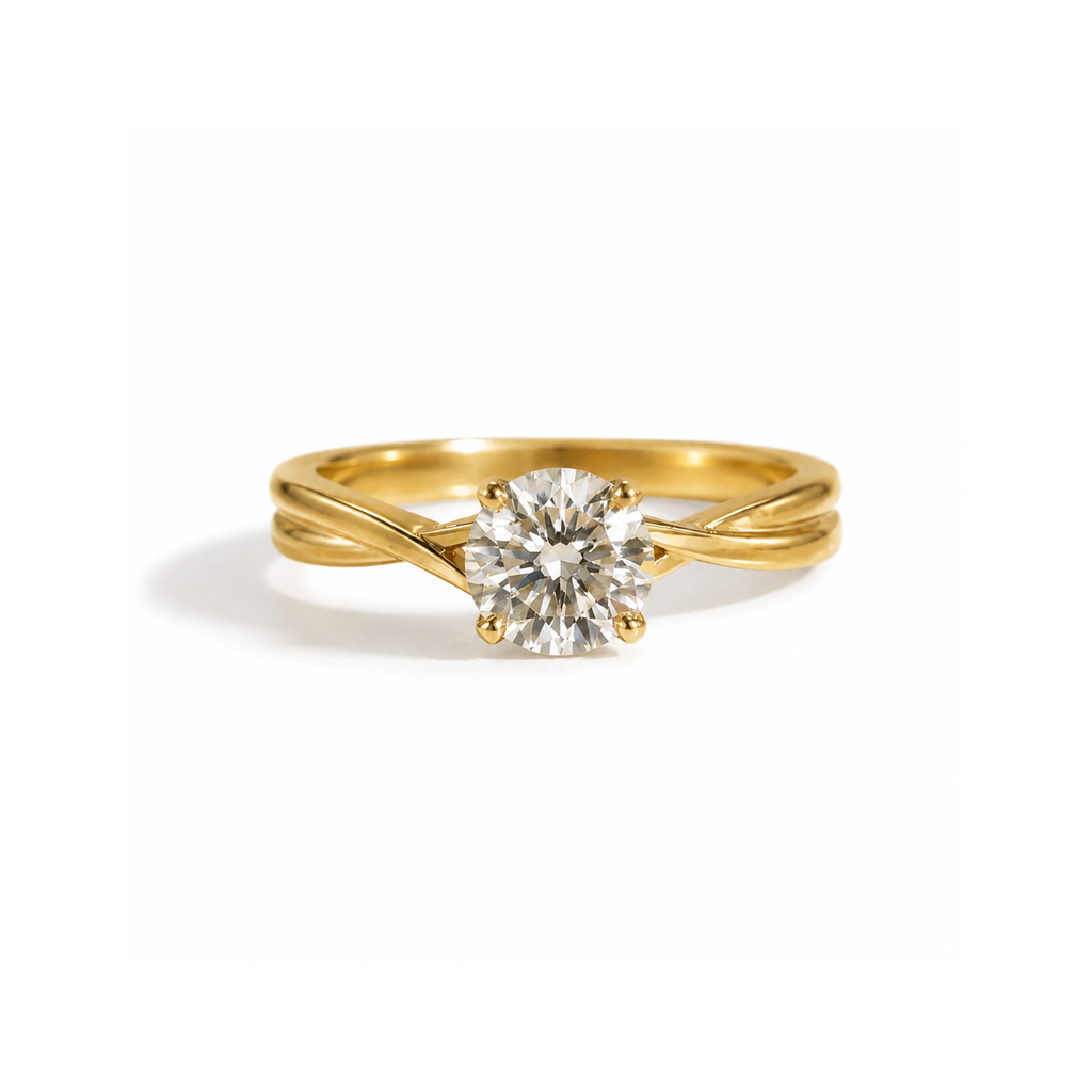 Mariette solitaire engagement ring in yellow gold with a round diamond, front view
