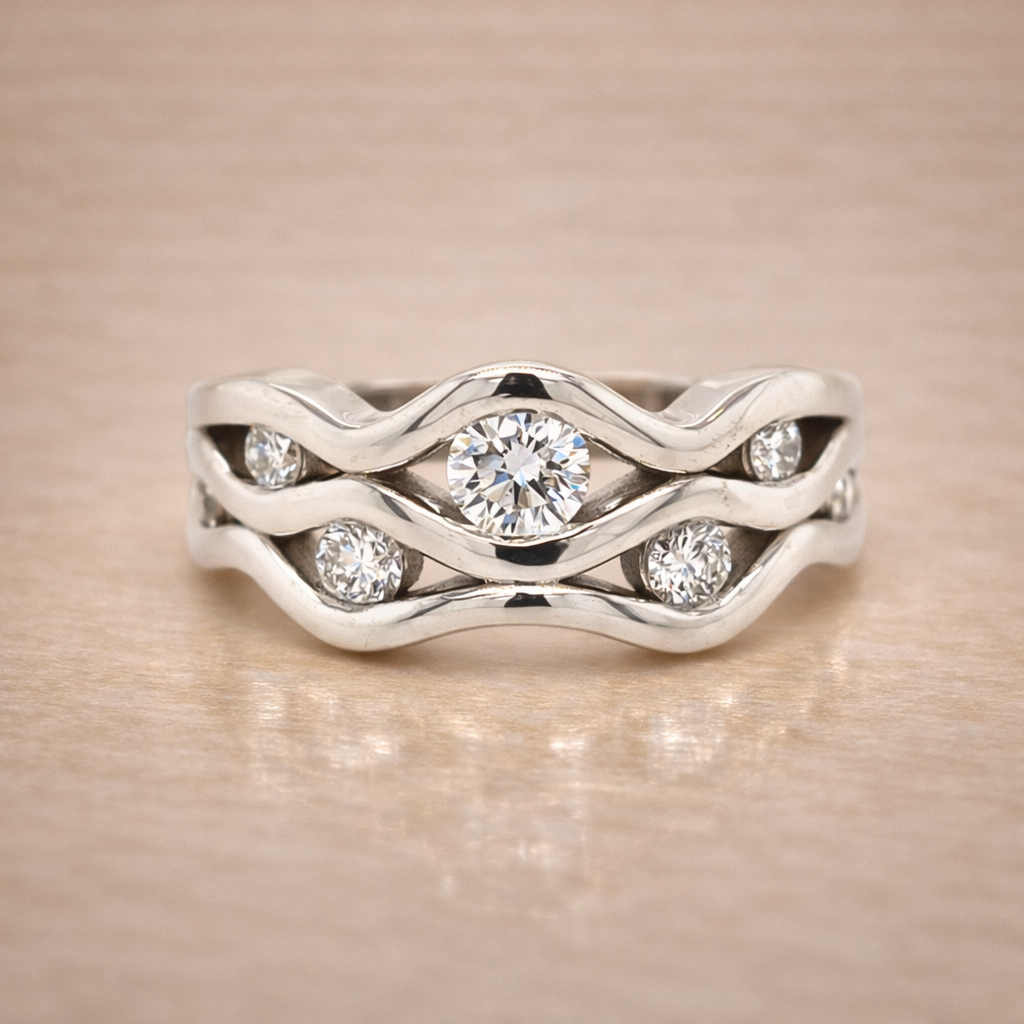 Silver ring with diamond stones on a beige background