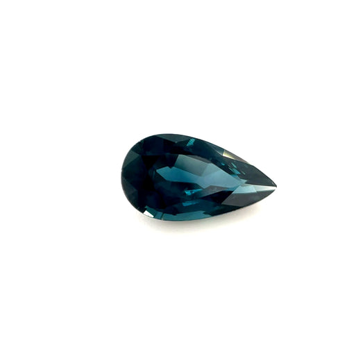 1.46ct Australian teal sapphire in a pear cut, shown against a plain white background